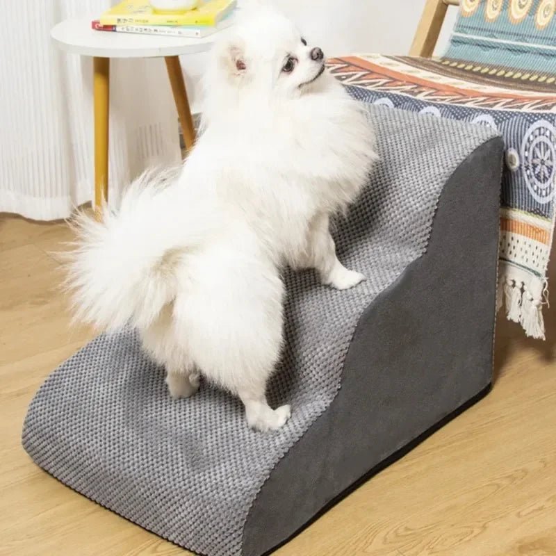 Grey 3-step pet stairs with white dog on it